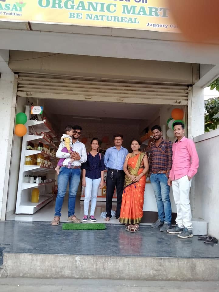 Orgasai Organic Mart store front with the team