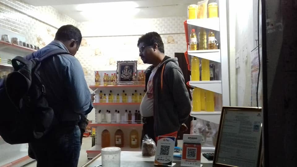 Shelves of Orgasai cold-pressed oils inside the store