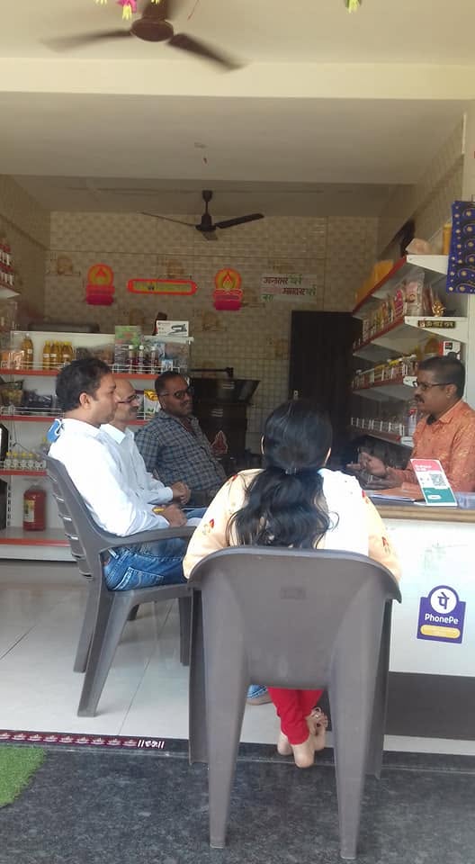 Team and customers seated at the Orgasai store